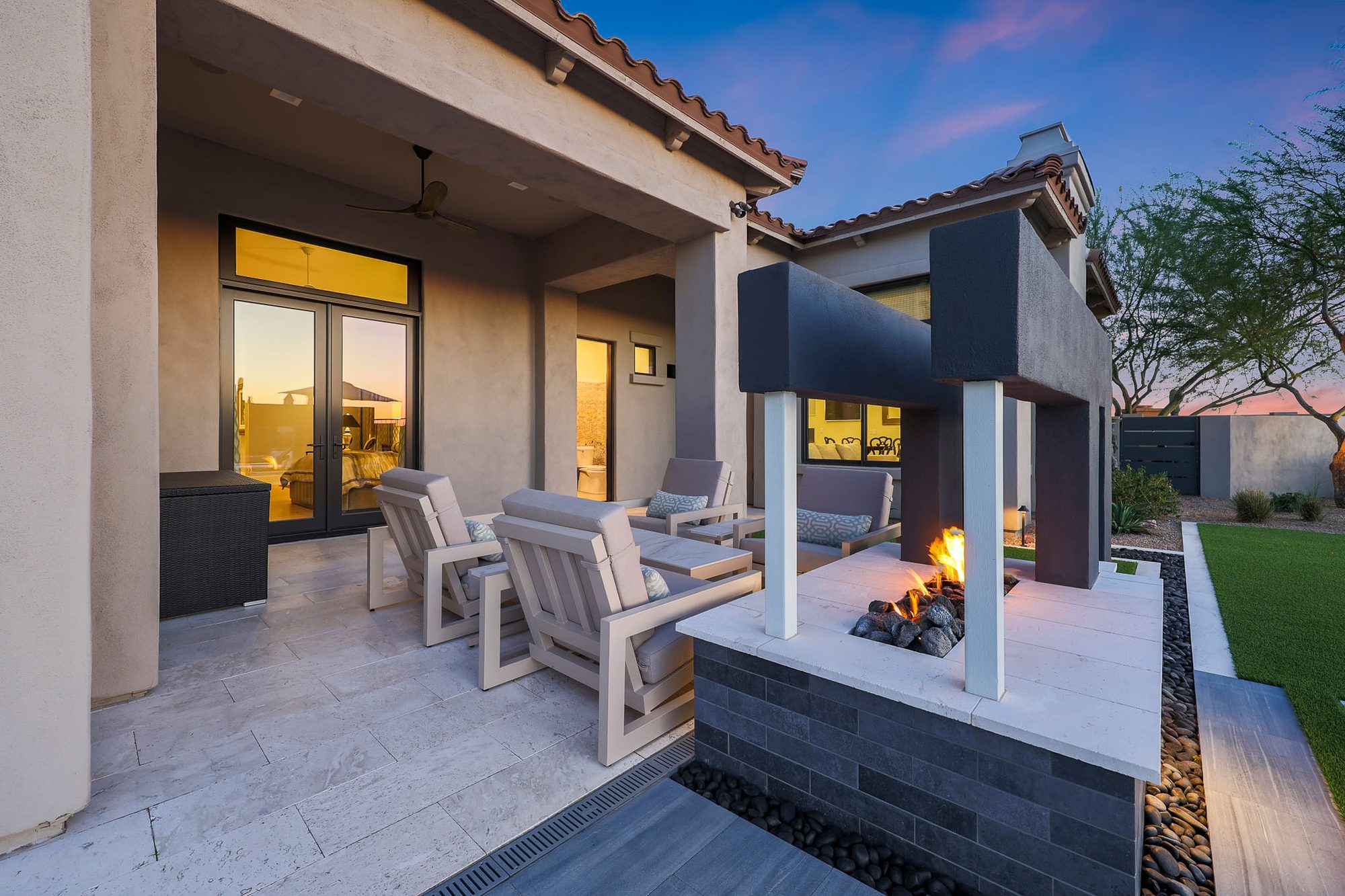 Outdoor patio fireplace at twilight