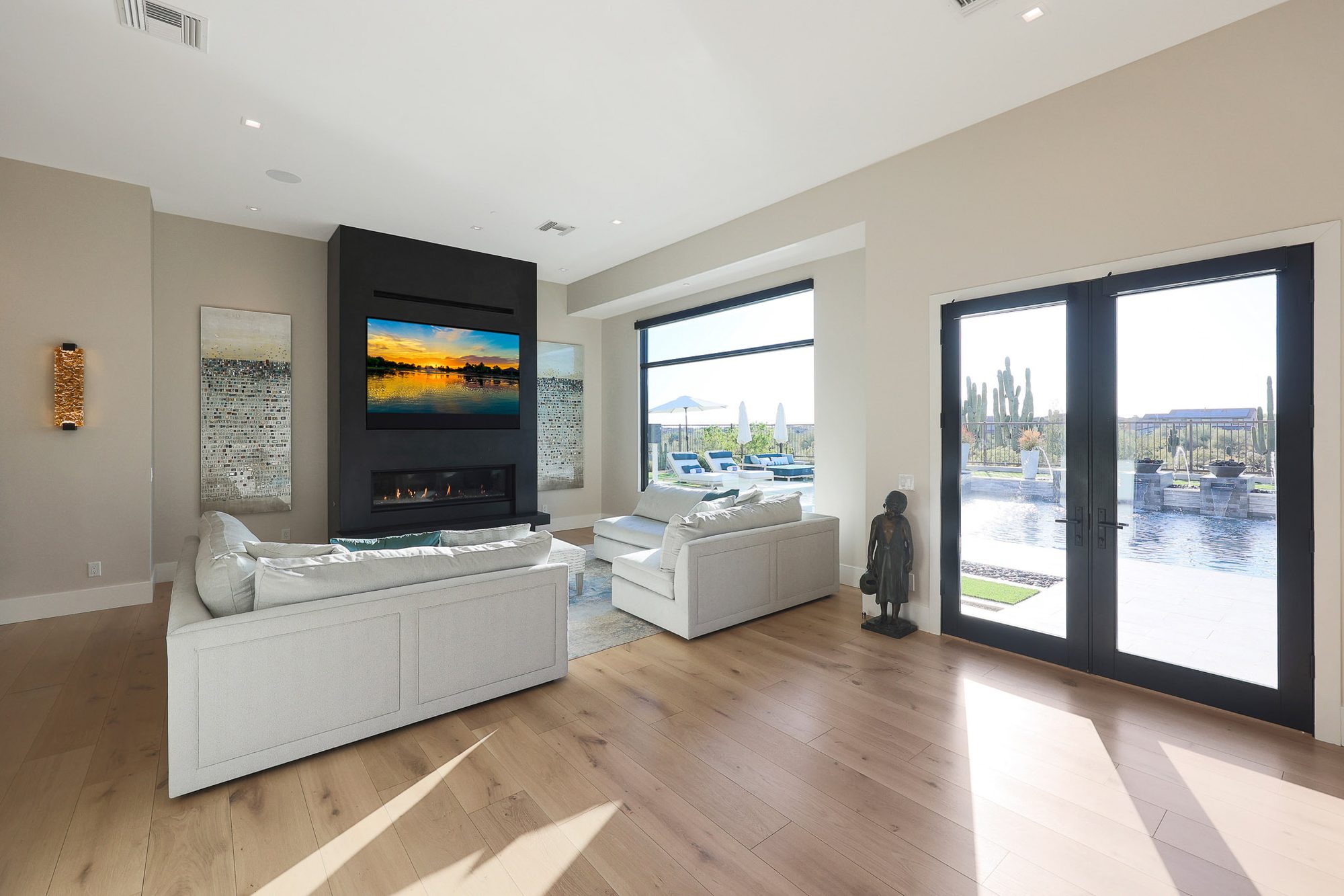 Formal living room with Napoleon gas fireplace in Black Twill granite