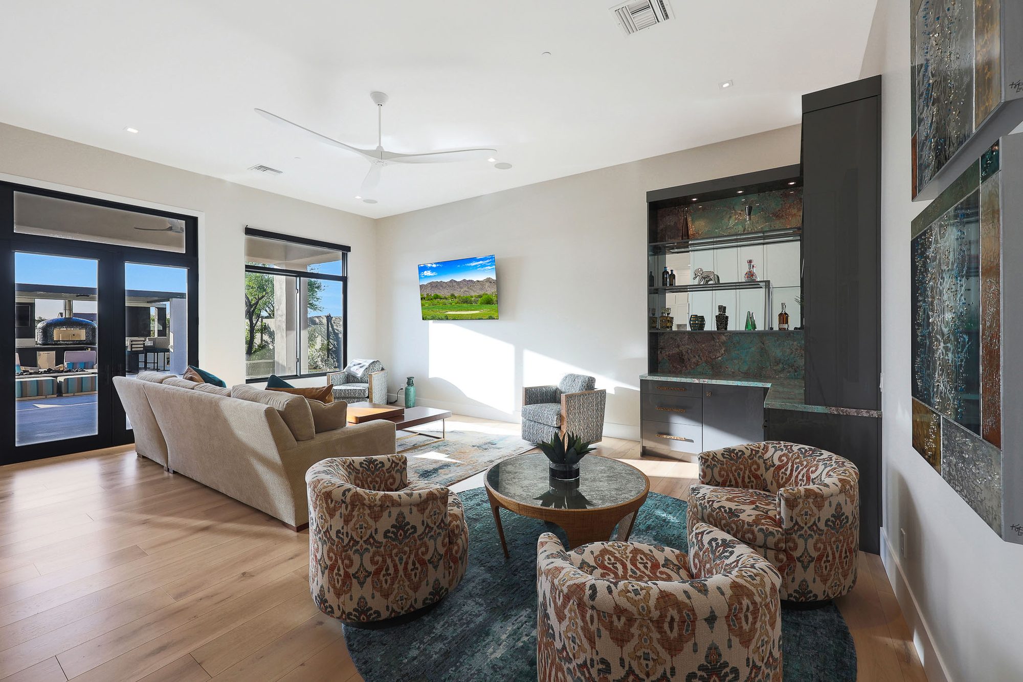 Family room with custom Tequila Bar in REFLECT metallic finish